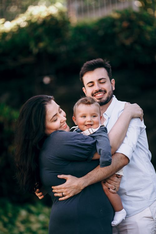 Family embracing in a park